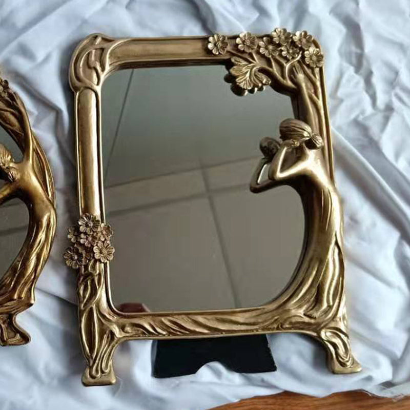 Art Nouveau-inspired gold decorative mirror with sculpted woman and floral details. A unique vintage-style tabletop mirror for elegant interiors.